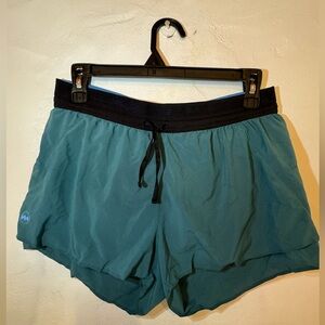 Janji AFO 3 inch middle shorts in the color Jasper